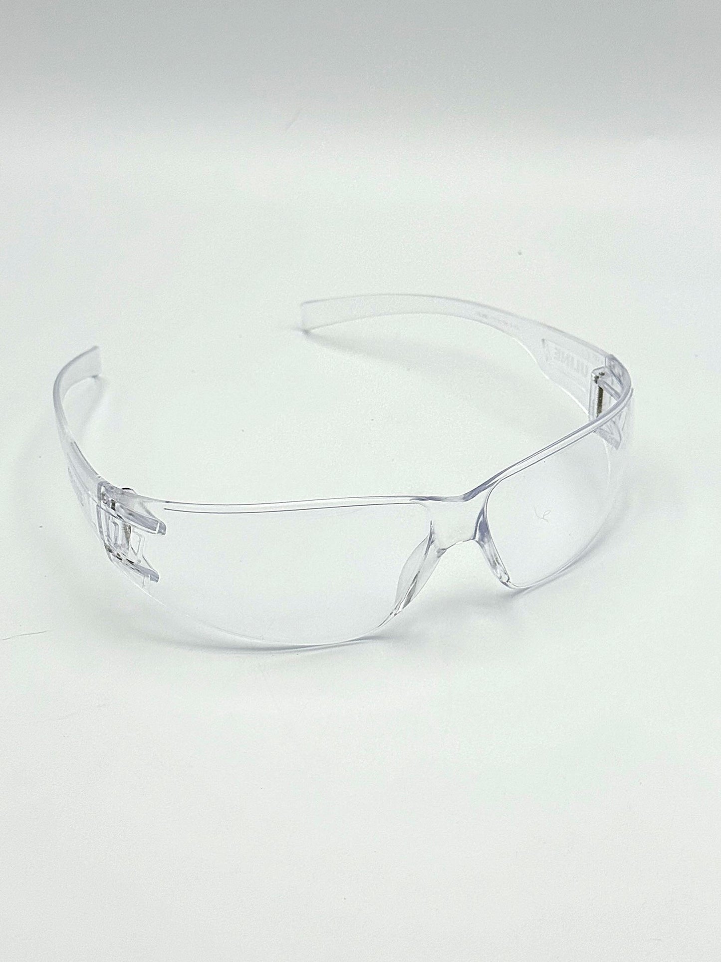 clear wrap around safety glasses on a white background