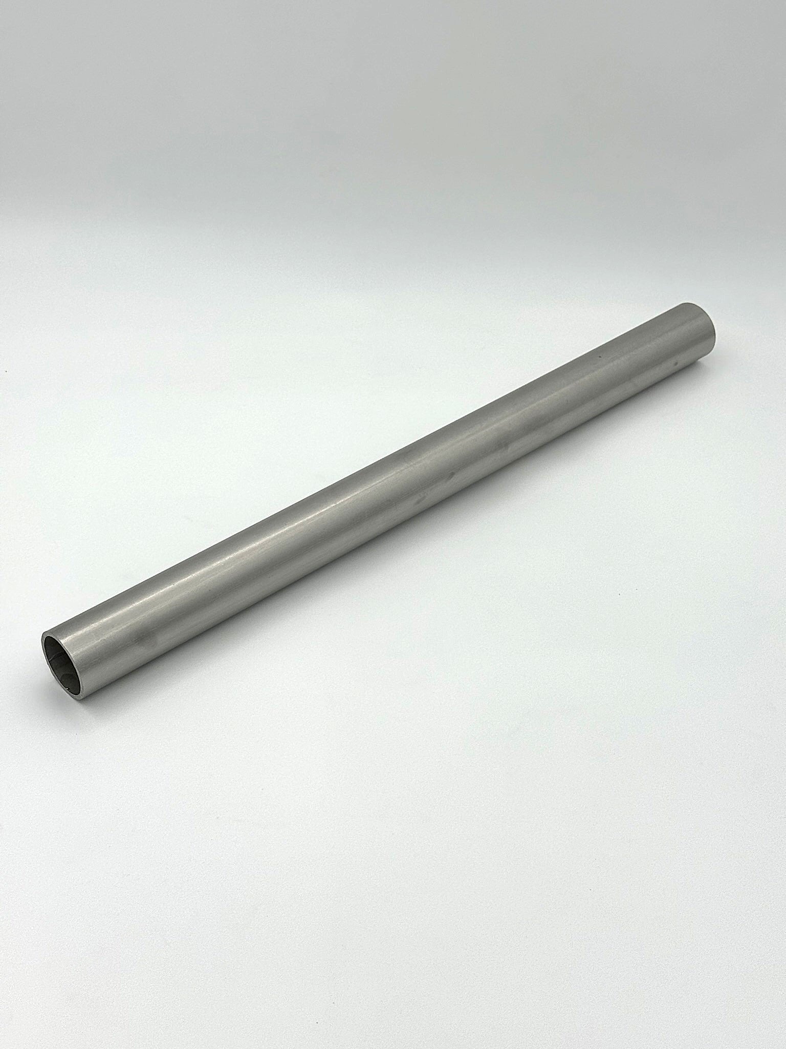 schedule 40 1.25" stainless steel metal pipe on a white background