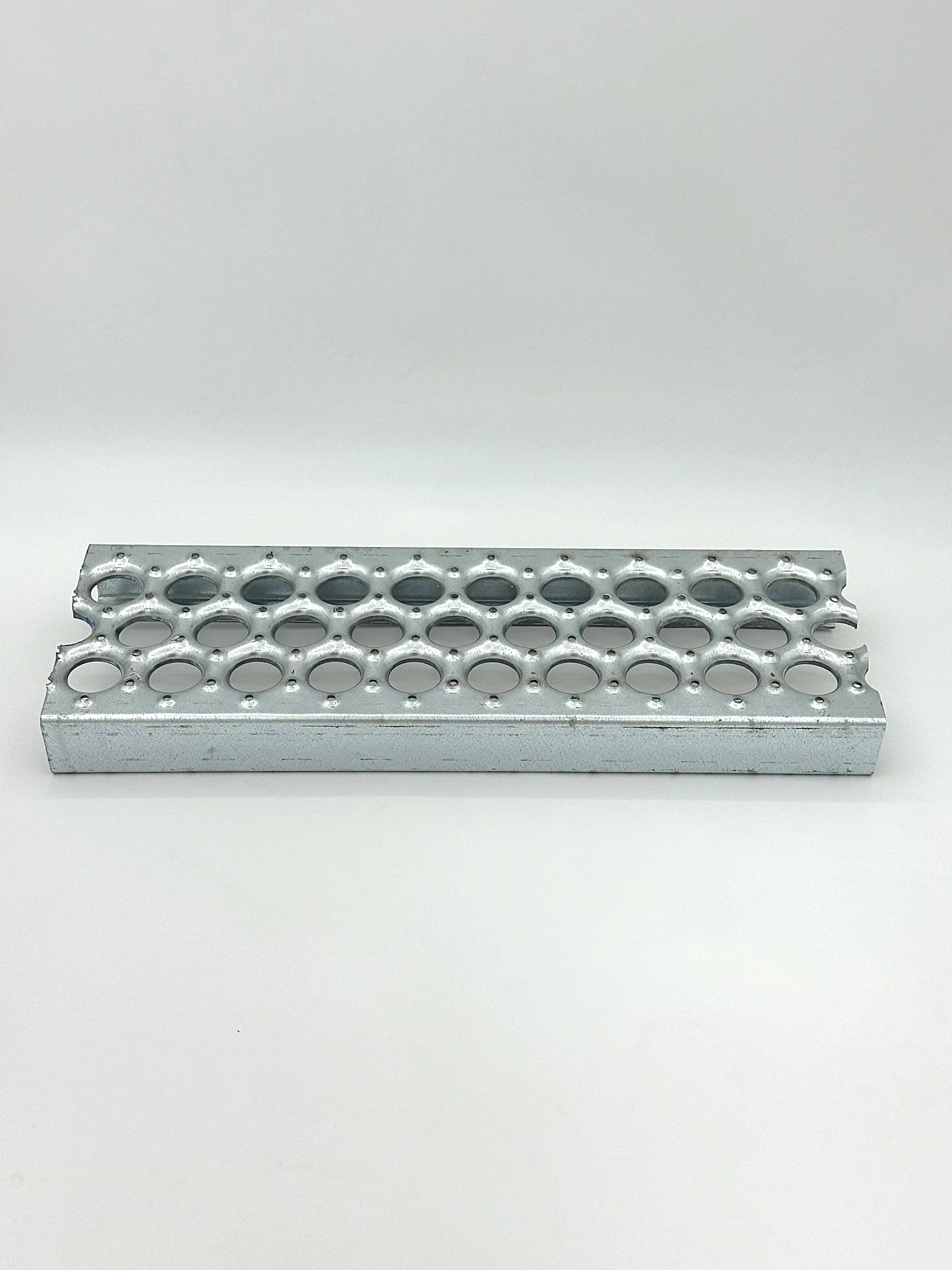 galvanized grip strut grating ladder material on a white background