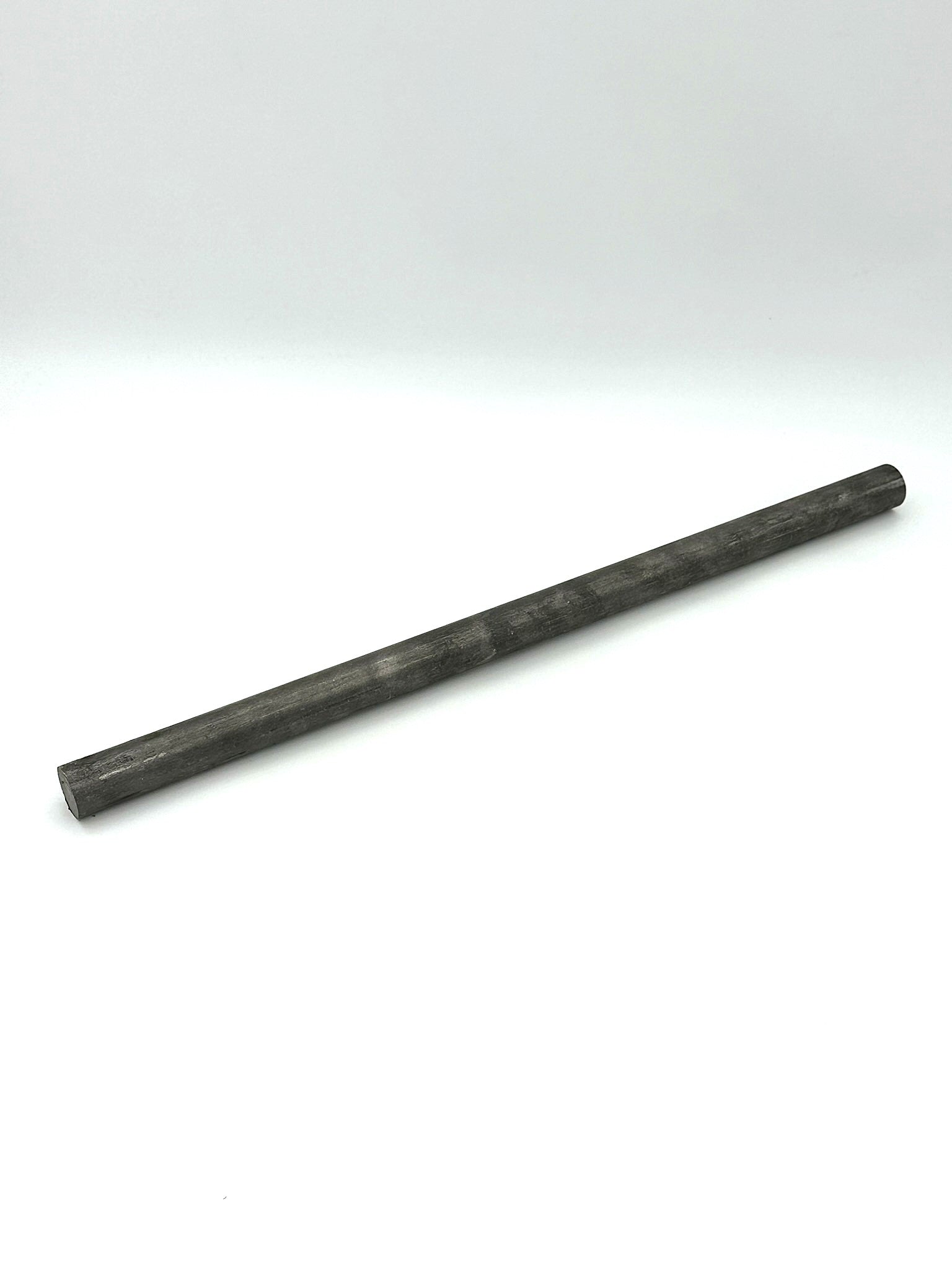 1.25" round carbon steel bar stock on a white background