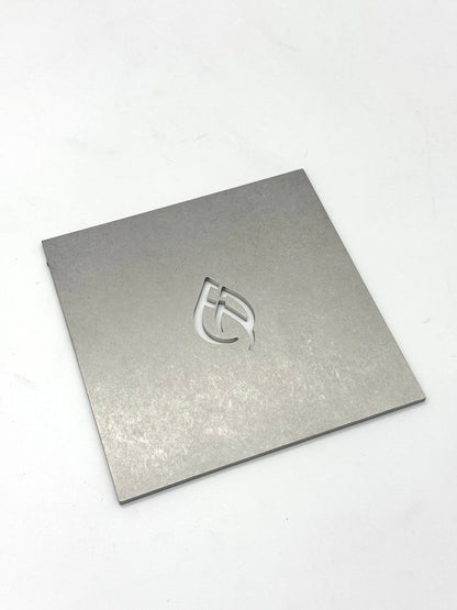 Laser cut sheet metal 5x5 square with EMBR Supply logo on the front