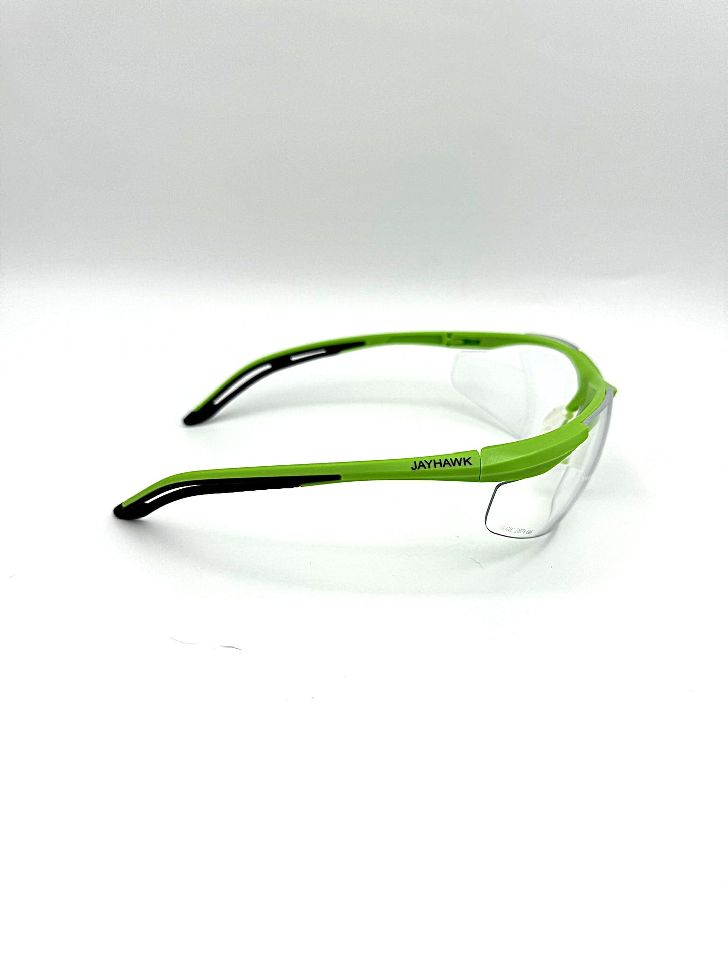 lime green framed safety glasses with clear anti-fog lenses on a white background