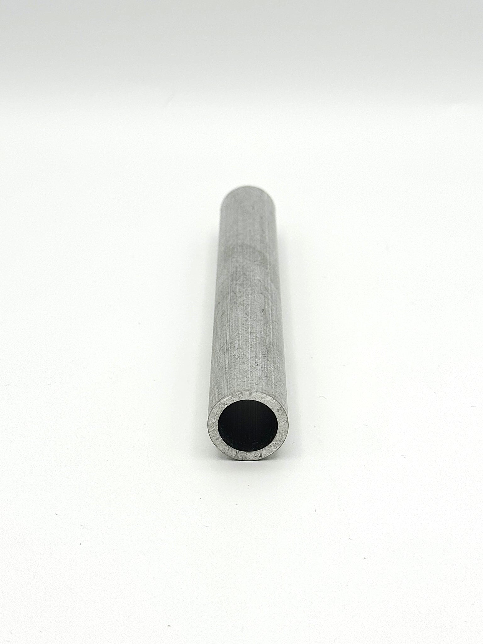 schedule 40 aluminum pipe piece on a white background